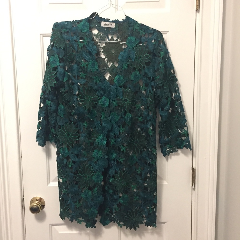 Dazzling emerald green jacket with cut out flowers